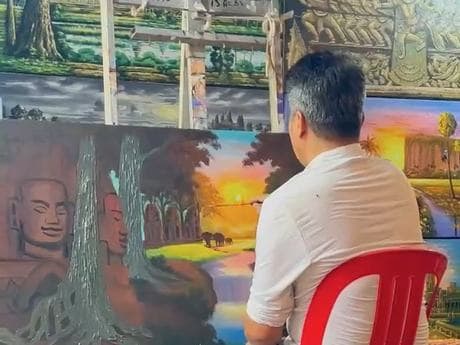 A Velea artist at work on a large canvas in the studio.