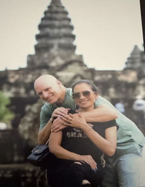 The original holiday photograph of a couple in front of Angkor Wat, printed and photographed.
